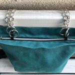 Top of waterproof green big fabric bag on bench