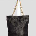 Indoor shoot of black triangle textured bag