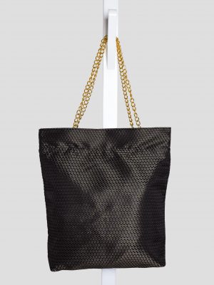 Indoor shoot of black triangle textured bag