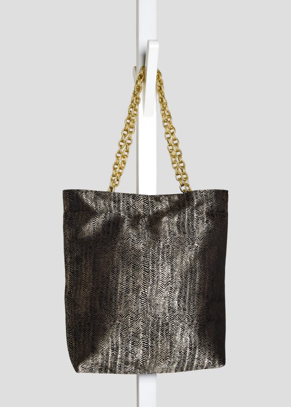 Indoor shoot of herringbone design textured bag