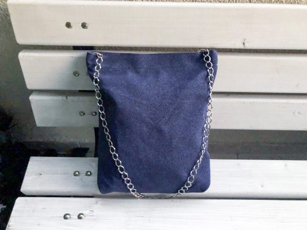 Front of blue cotton bag on the bench