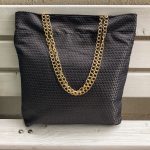 Front of the black triangle textured bag