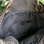 Interior detail of the black triangle textured bag