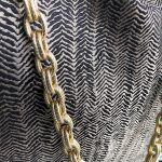 Hanger detail of the herringbone design textured bag