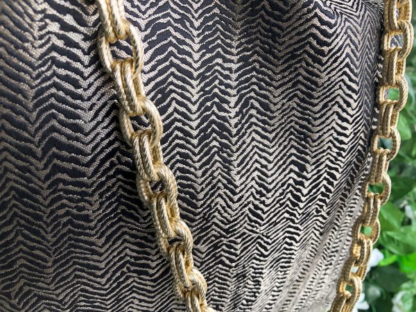 Hanger detail of the herringbone design textured bag