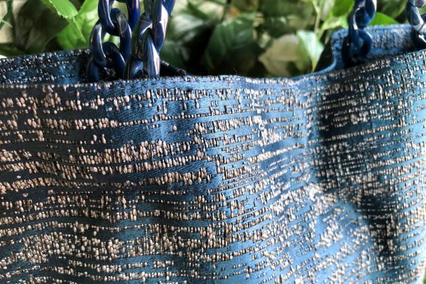 Fabric detail of striped blue fabric bag