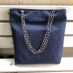 Front of big blue cotton bag on the bench